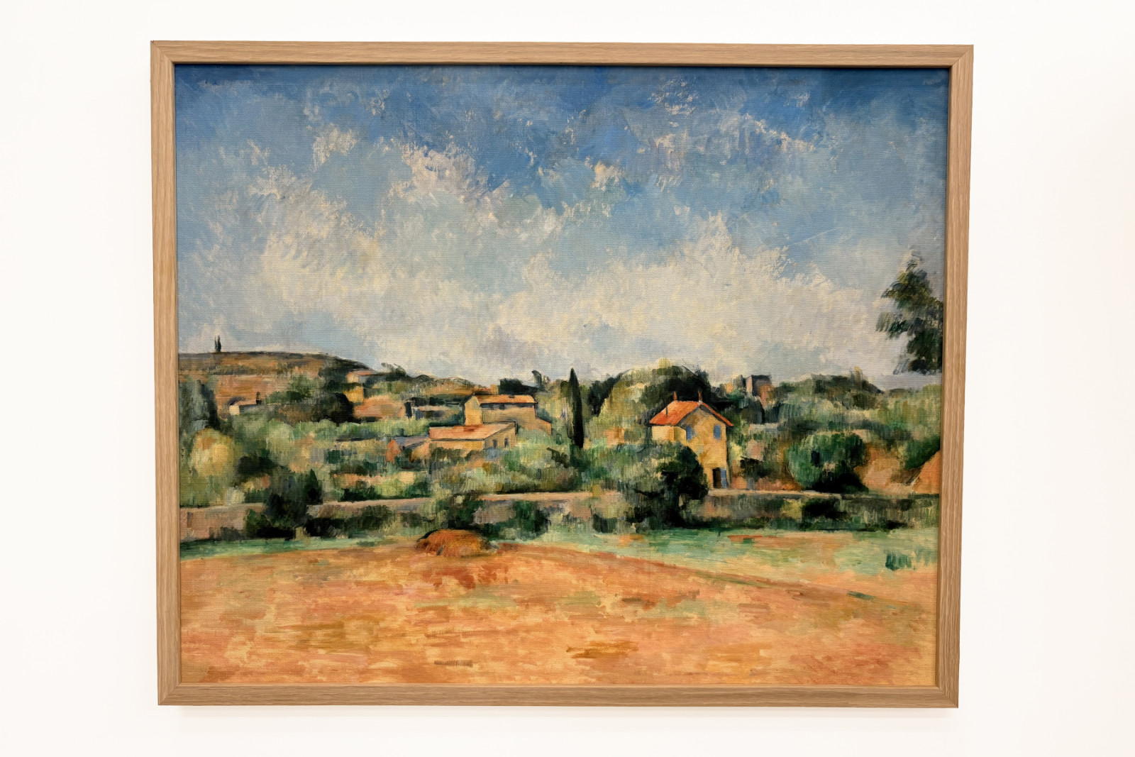 La llanura de Bellevue / La tierra roja - Paul Cézanne