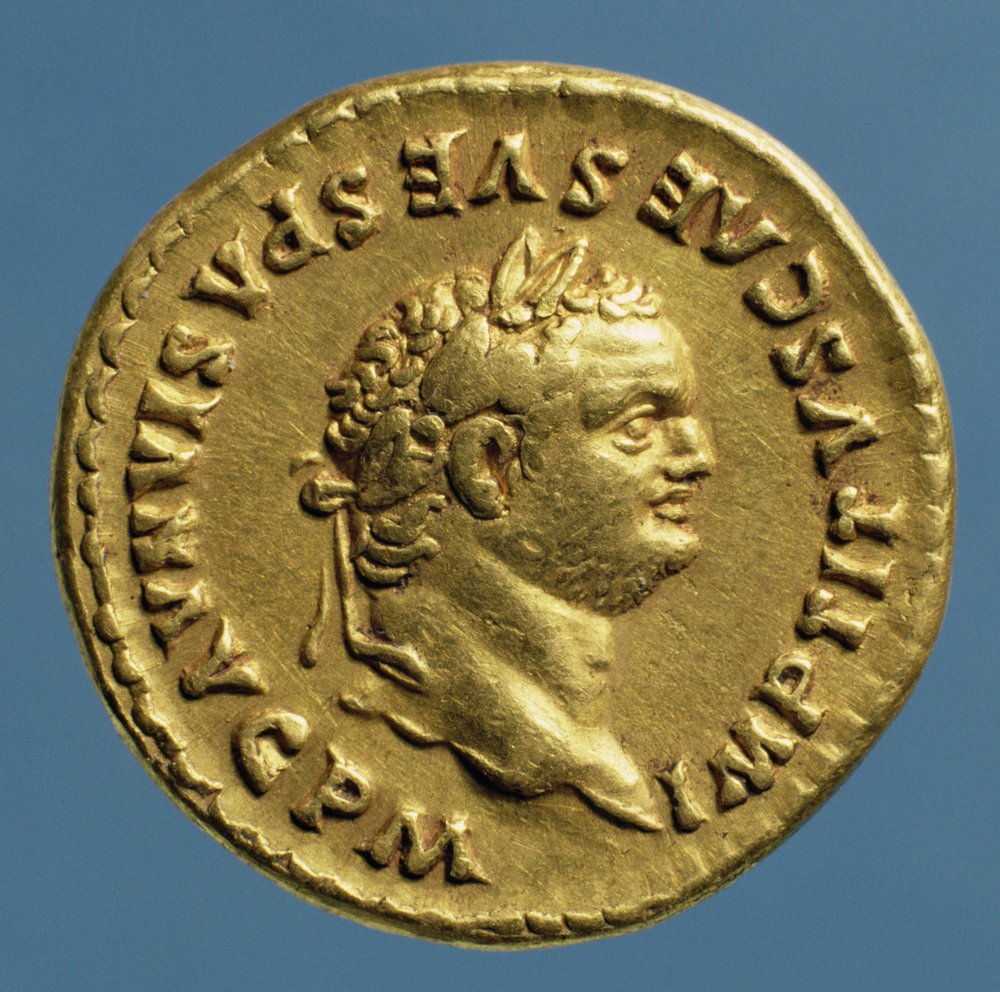 Áureo (anverso) de Tito (79-81 d.C.) con corona de laurel. Inscripción: IMP TITVS CAES VESPASIAN AVG P M de Roman