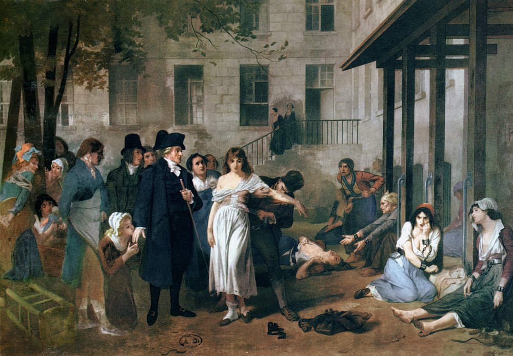 Philippe Pinel (1745-1826) liberando a los lunáticos de sus cadenas en el asilo de la Salpêtrière en París en 1795 de Tony Robert-Fleury
