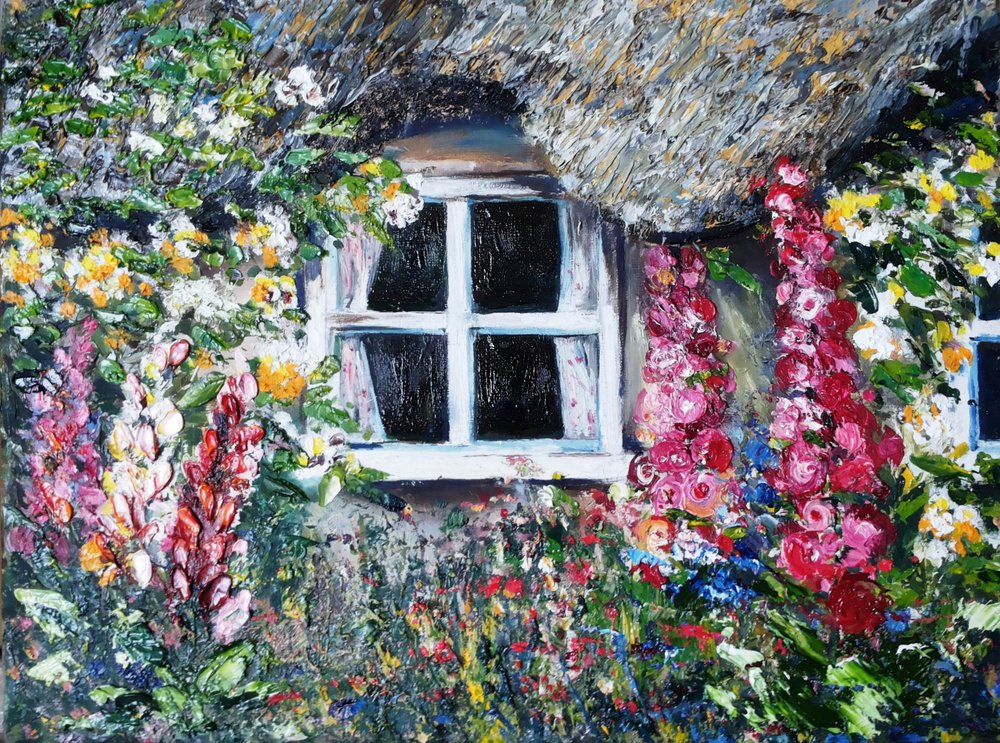 Jardín en la ventana de una casita de campo de Anda Bieza