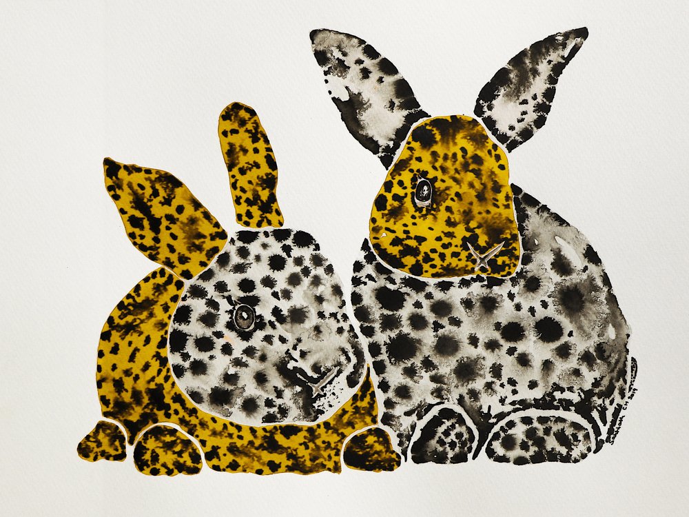 Conejos amarillos moteados de Santhosh ch