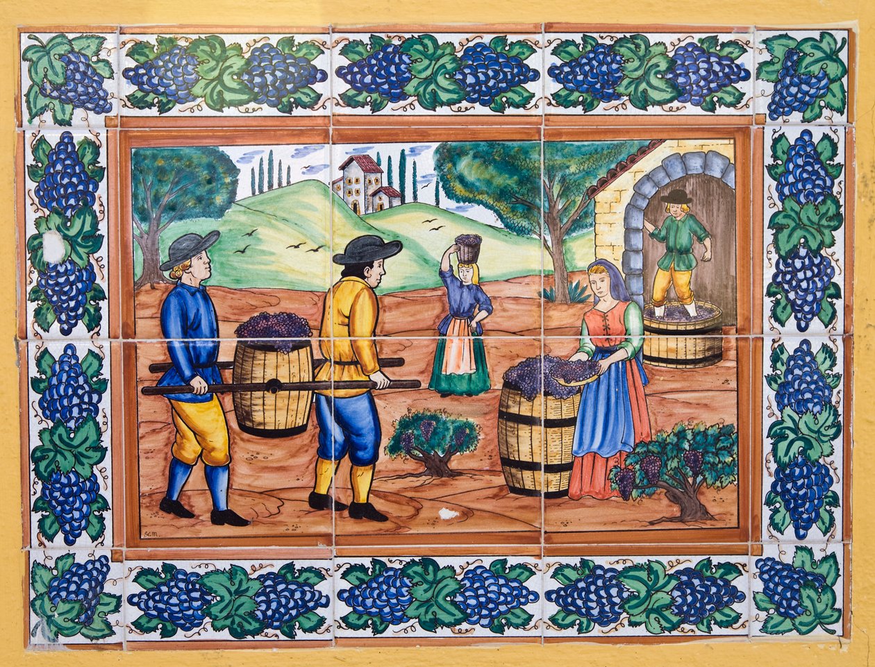 Azulejos cerámicos españoles modernos al estilo del siglo XVII o XVIII que muestran a trabajadores llevando uvas de vuelta a la bodega del viñedo de Unknown