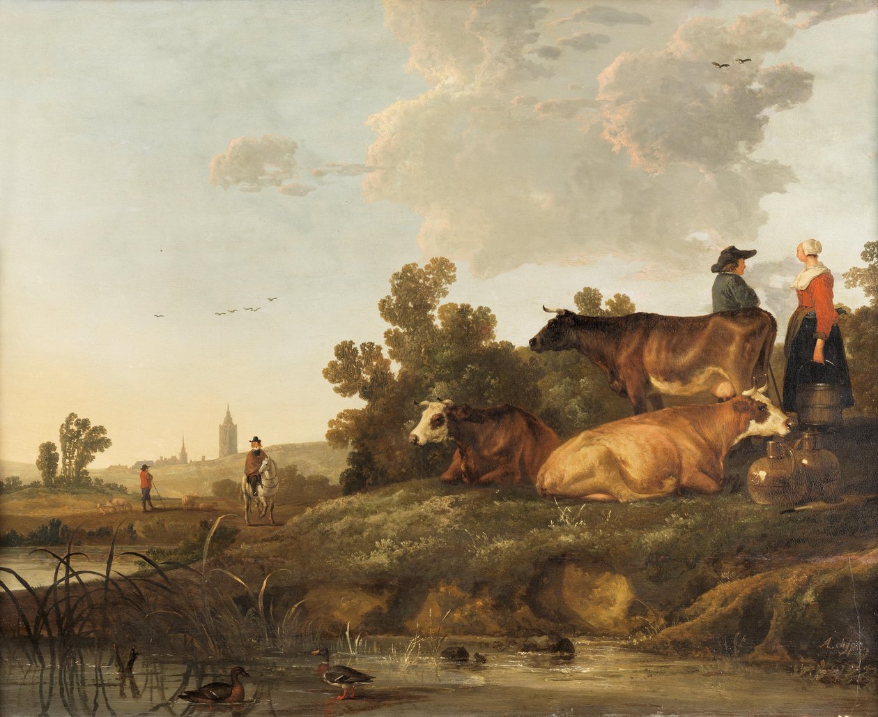 Un pastor y una lechera de pie junto al ganado, vista de un pueblo a lo lejos de Aelbert Cuyp