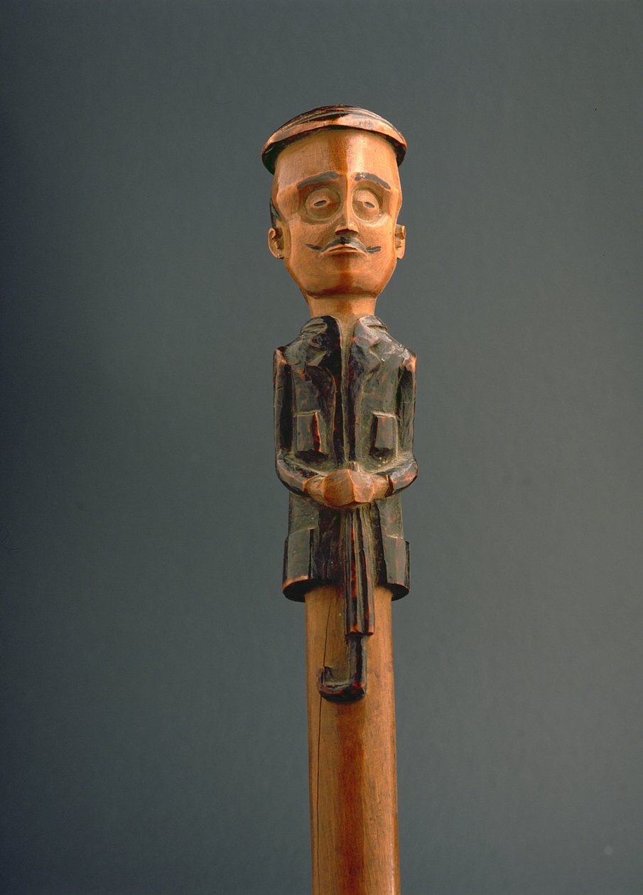 Bastón con figura de un hombre europeo con gorra y paraguas, Ovimbundu, Angola, finales del siglo XIX de African