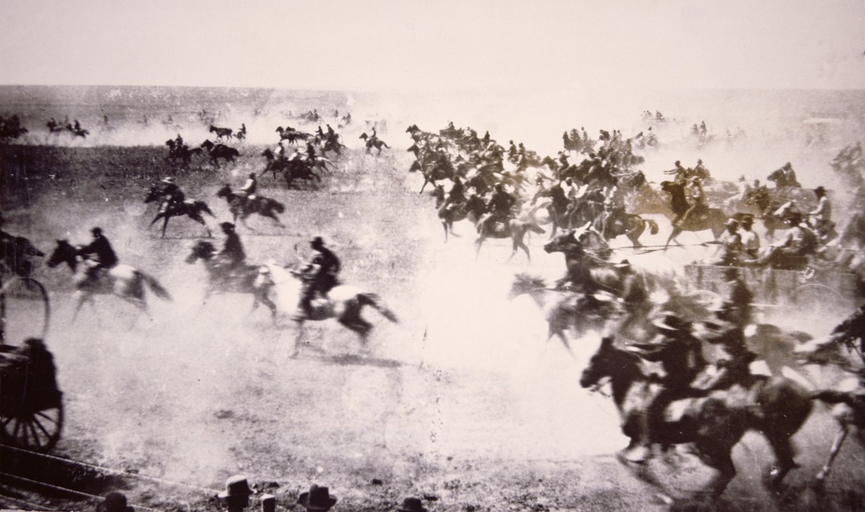 Colonos corriendo hacia la Franja Cherokee de American Photographer