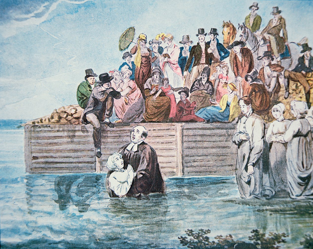 Anabaptistas de Filadelfia presencian un bautismo por inmersión total en un río de American School