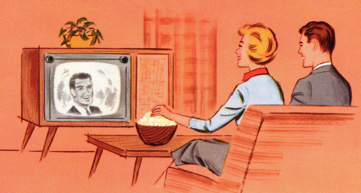 Pareja viendo un televisor retro en su guarida de American School