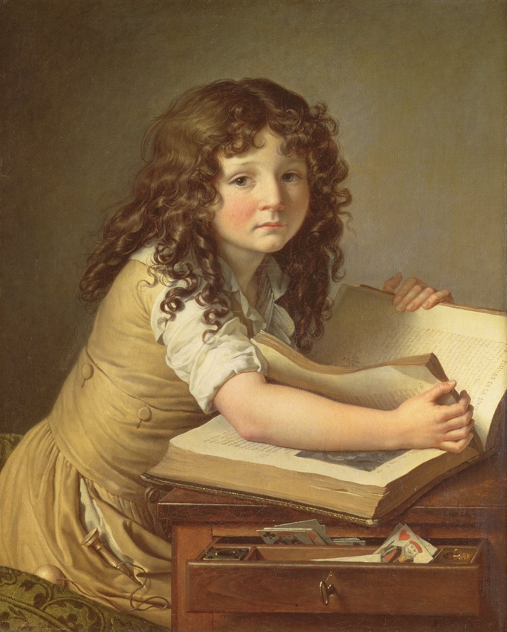 Un niño mirando imágenes en un libro de Anne Louis Girodet de Roucy Trioson