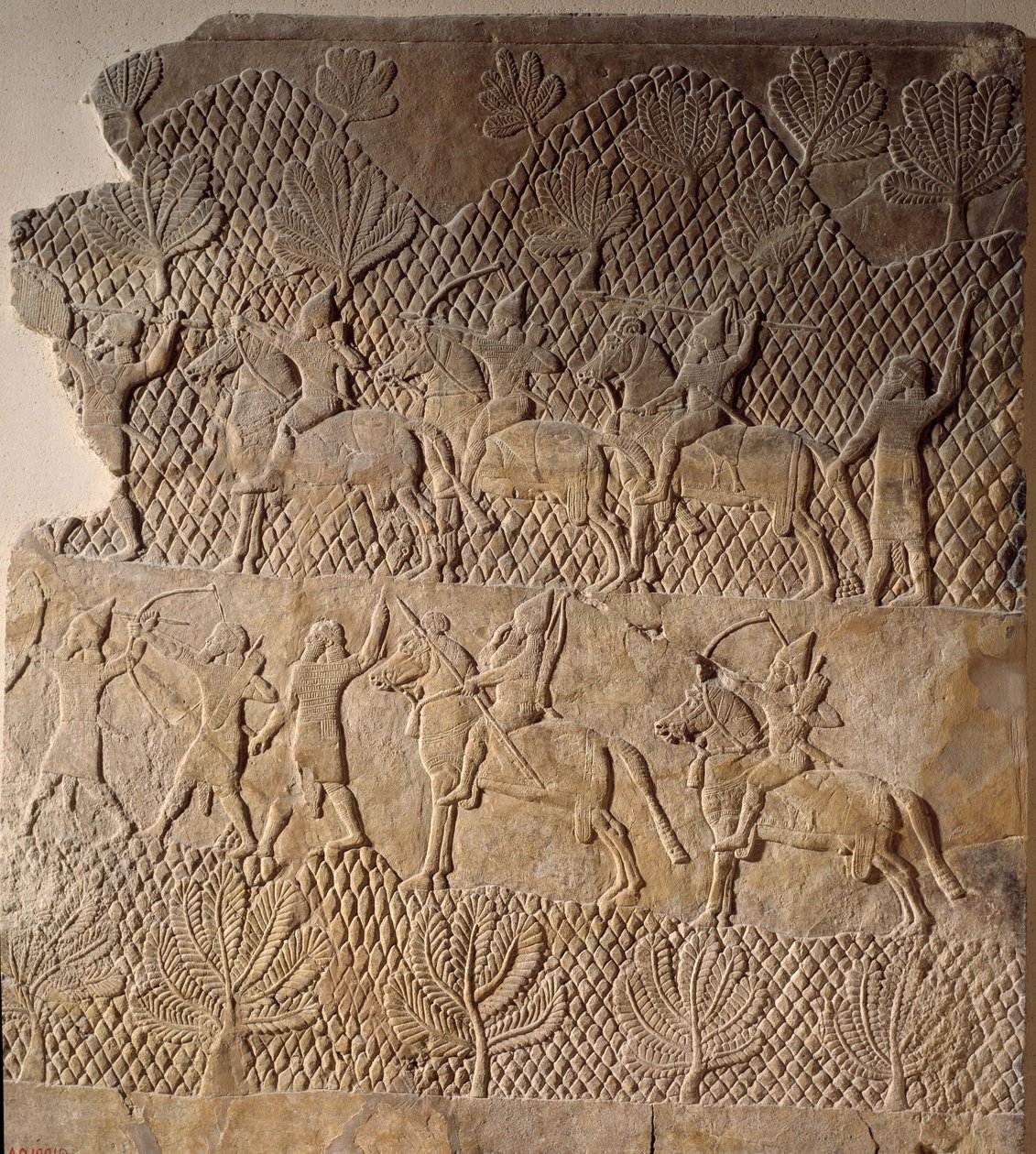 Arte oriental de la antigüedad: escena de batalla. Bajorrelieve del Palacio de Asurbanipal, Asiria (siglo VII a.C.). París, Museo del Louvre de Assyrian
