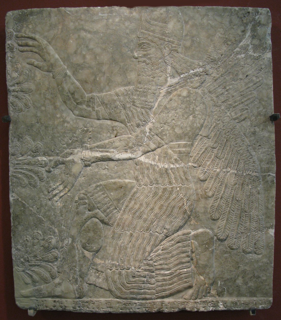 Deidad alada junto al árbol sagrado de Assyrian