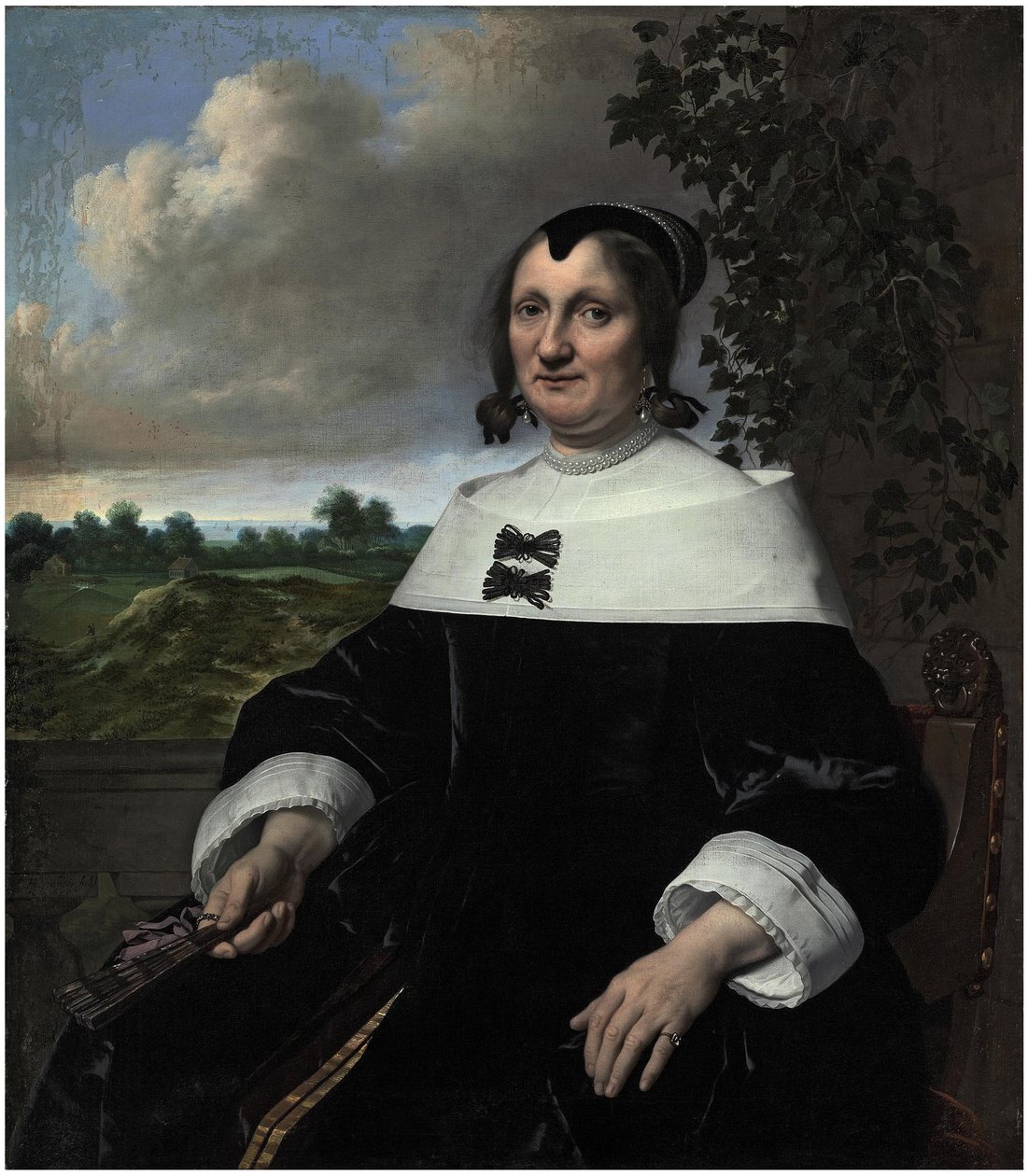 Retrato de una dama, probablemente Hester du Pire, sentada ante una balaustrada, con un abanico en la mano, con vistas al mar. de Bartholomeus van der Helst