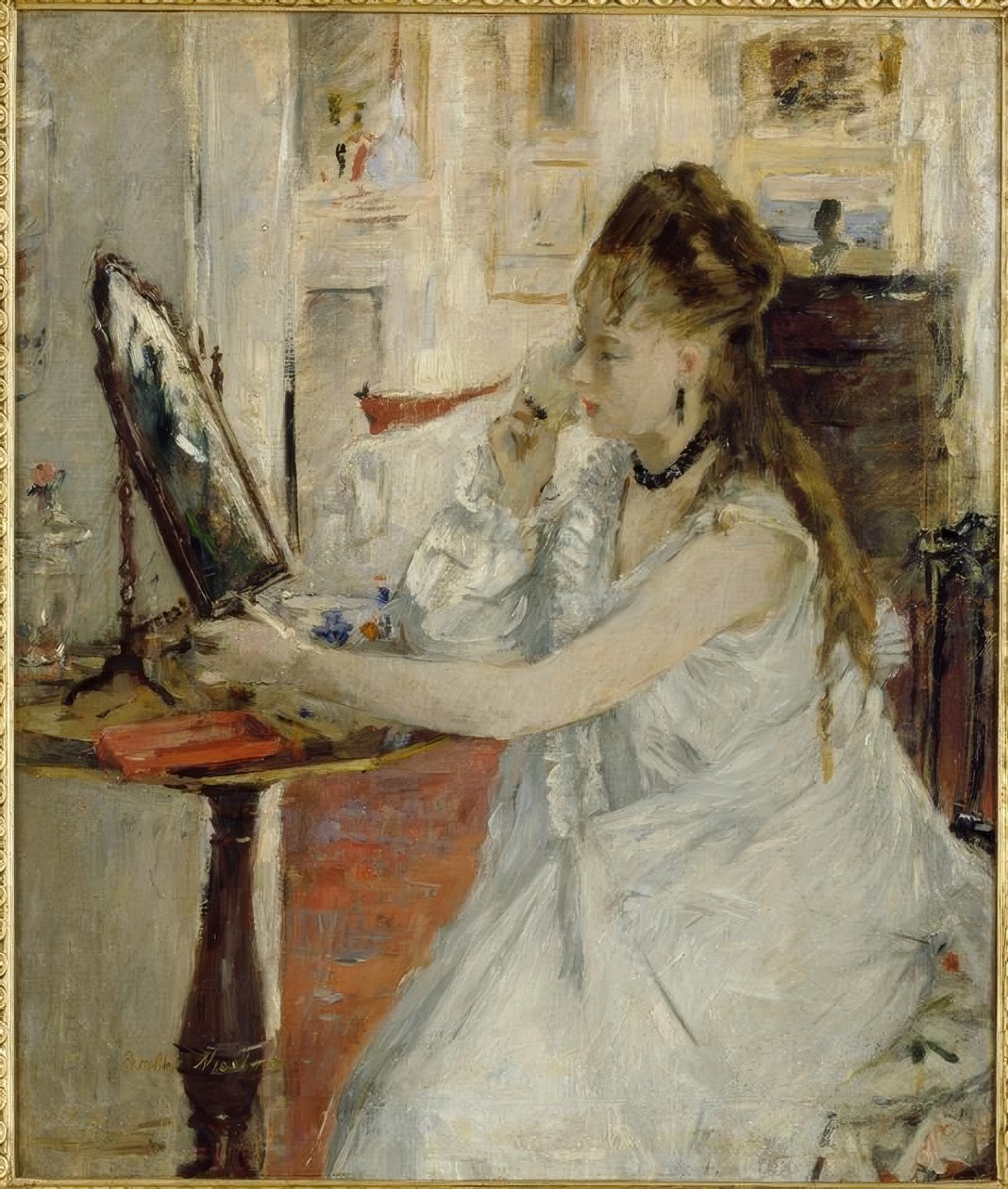 Joven mujer empolvándose de Berthe Morisot