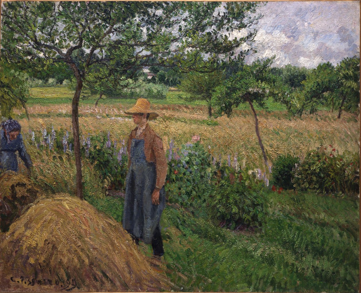 Jardinero junto a un pajar, cielo nublado, Éragny de Camille Pissarro
