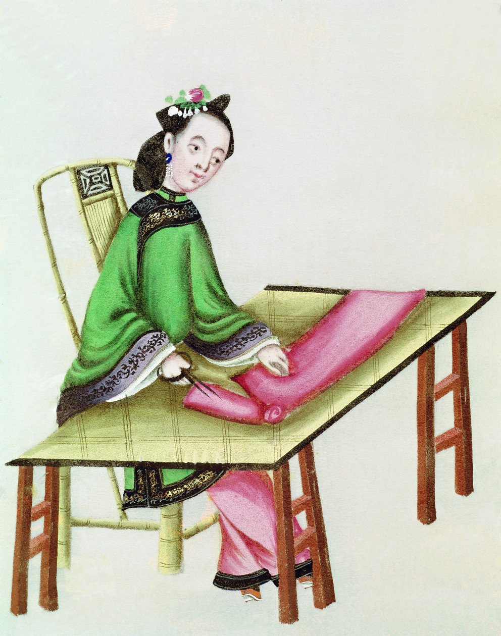 Una mujer china cortando tela, período Qianlong (1736-96) de Chinese School