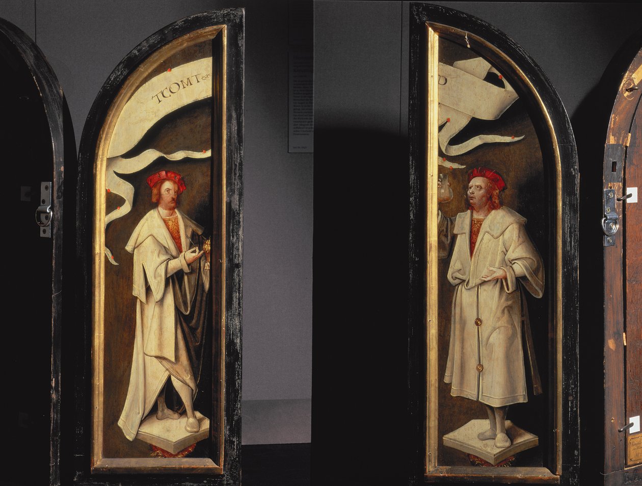 La limpieza de Naamán Tríptico: paneles laterales que representan a los mártires Cosme y Damián, protectores contra la enfermedad, 1520 de Cornelis Engebrechtsz