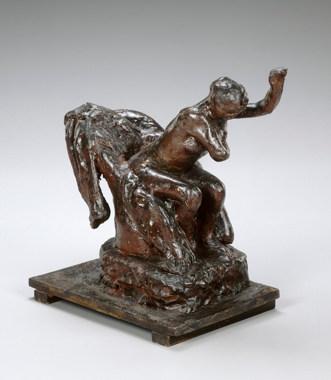 Mujer sentada en un sillón, limpiándose la axila izquierda, c.1890s de Edgar Degas