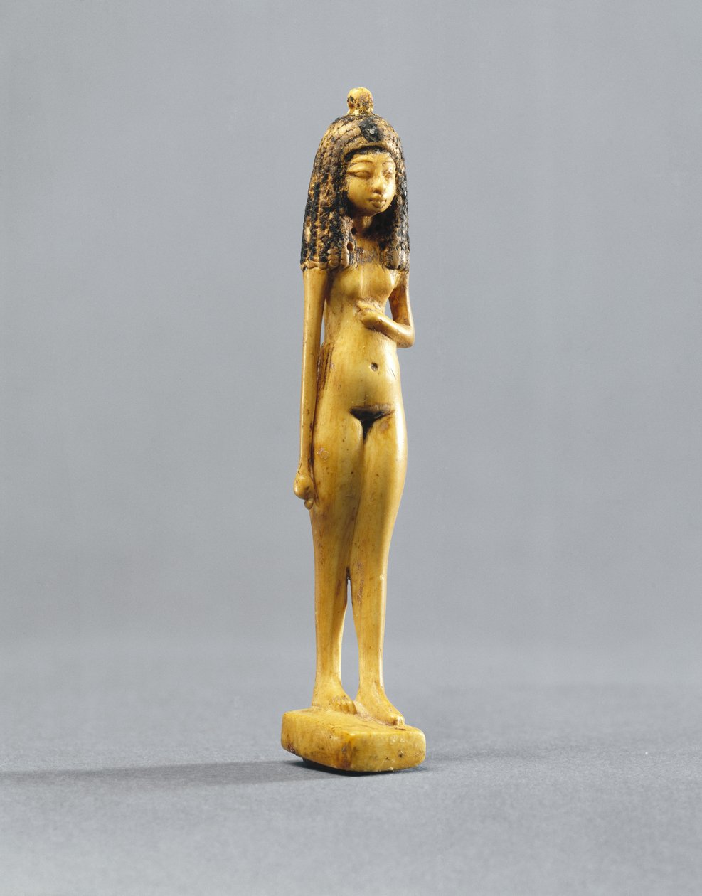 Estatuilla de una niña desnuda, Nuevo Reino, c.1390-1353 a.C. de Egyptian 18th Dynasty