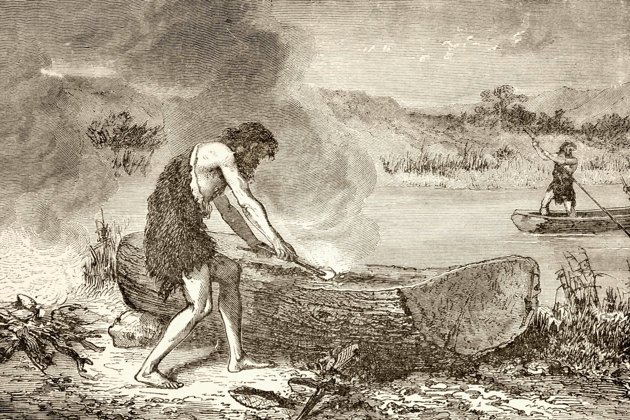 Un hombre prehistórico usando fuego para fabricar una canoa a partir de un tronco de English School