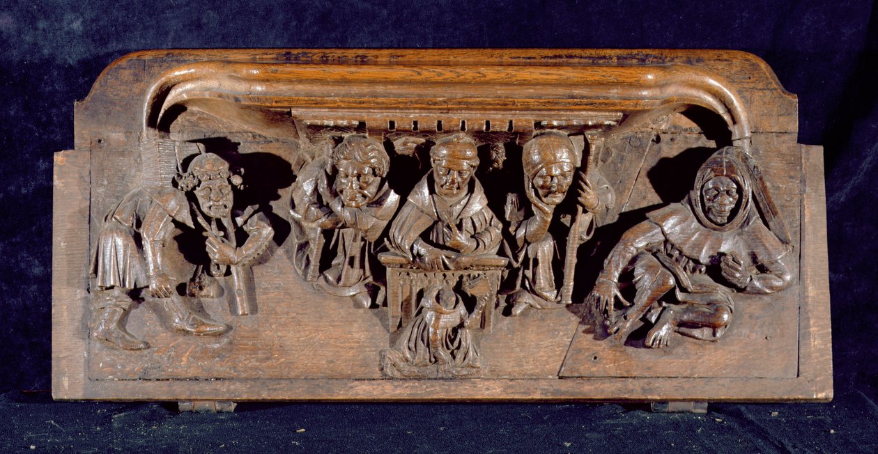 Una misericordia que representa a un académico sentado en un escritorio panelado dando una amonestación a un penitente arrodillado, Capilla del New College, Oxford, finales del siglo XIV (madera) de English School