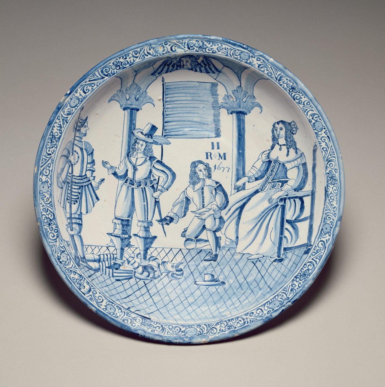 Plato con la Reina Catalina sentada mientras un caballero arrodillado le ajusta un zapato, 1677 de English School