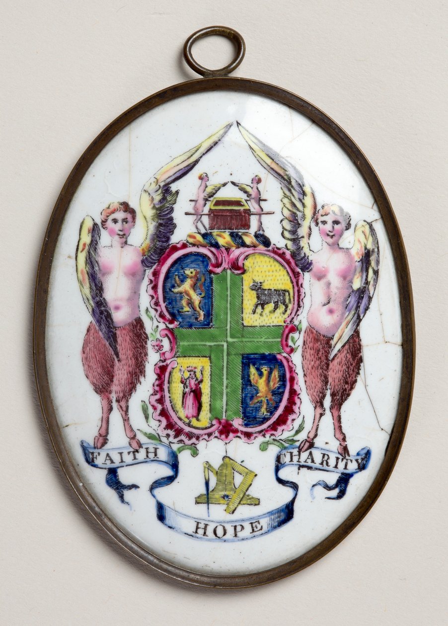 Placa ovalada mostrando la insignia de los masones de English School