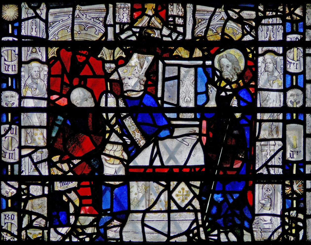 Ventana w6 que representa una escena de la vida de San Nicolás; borde con figuras de English School