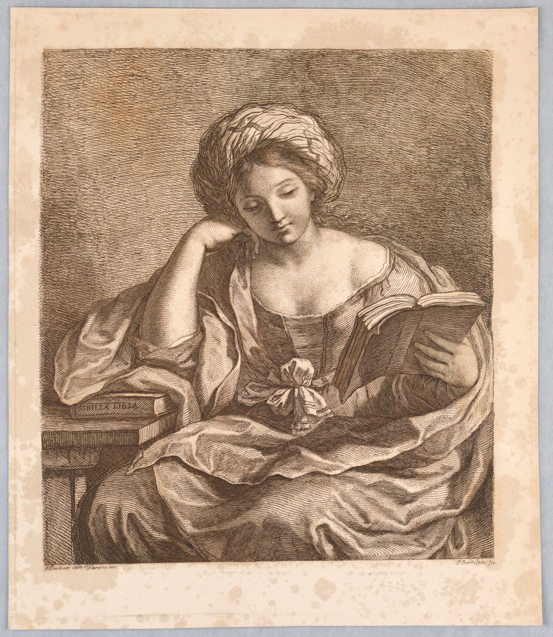Una sibila, con un libro de Francesco Bartolozzi