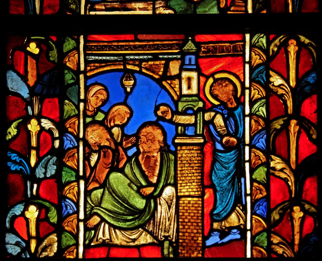 Una escena de la Vida de San Nicolás, ex Catedral de Troyes: el santo deja dinero a un hombre evitando así que sus hijas entren en la prostitución de French School