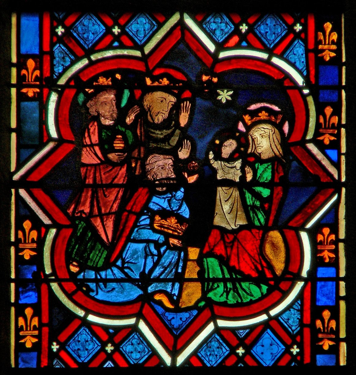 Escena en la ventana E que representa la Adoración de los Magos de French School