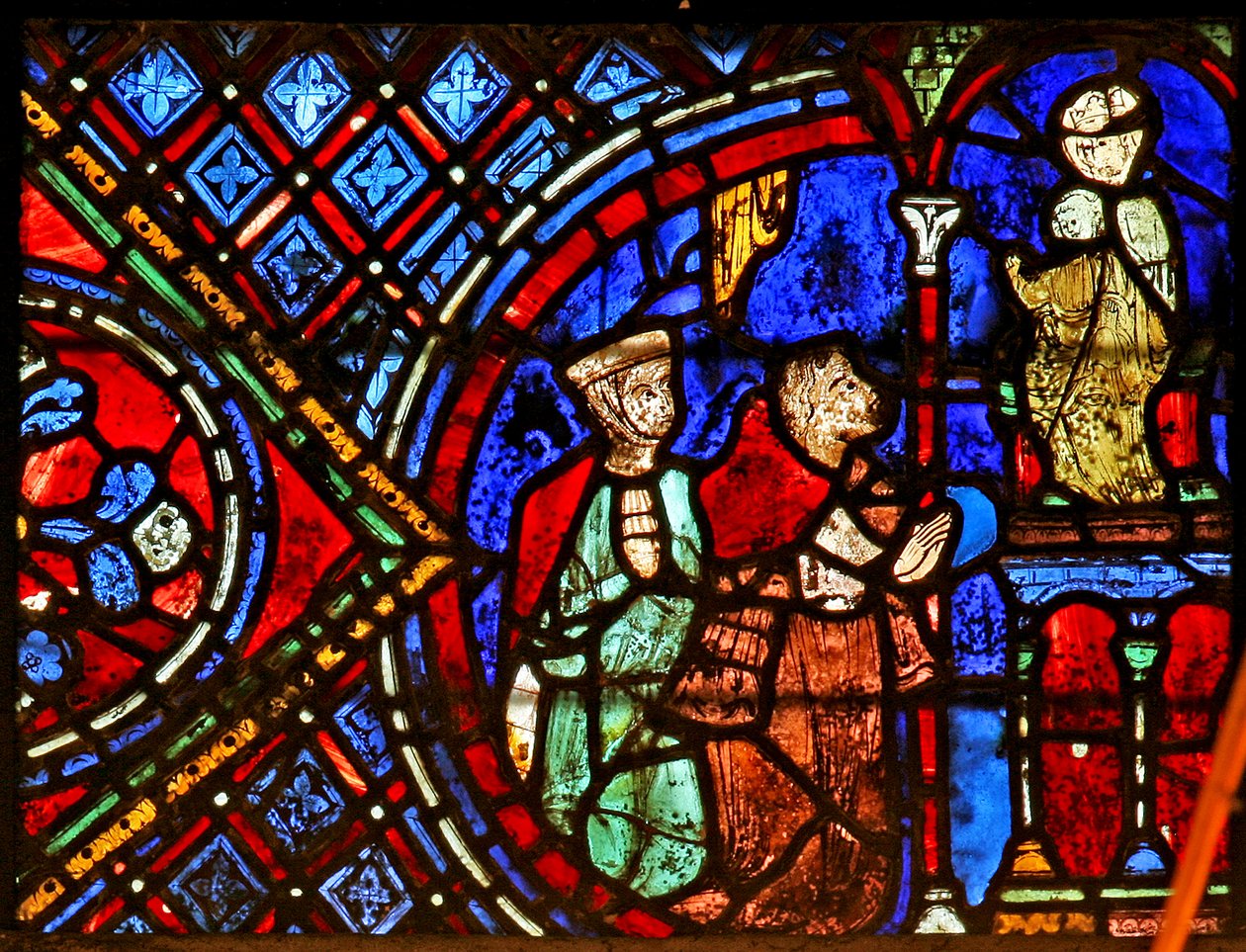 Dos donantes ante una estatua de la Virgen de French School