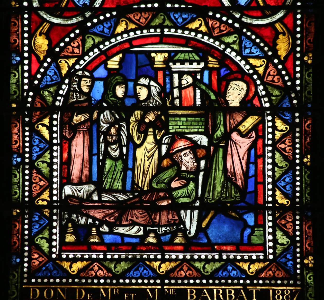 Ventana w13 que representa la comida en la casa de Simón. María Magdalena lava los pies de Cristo de French School