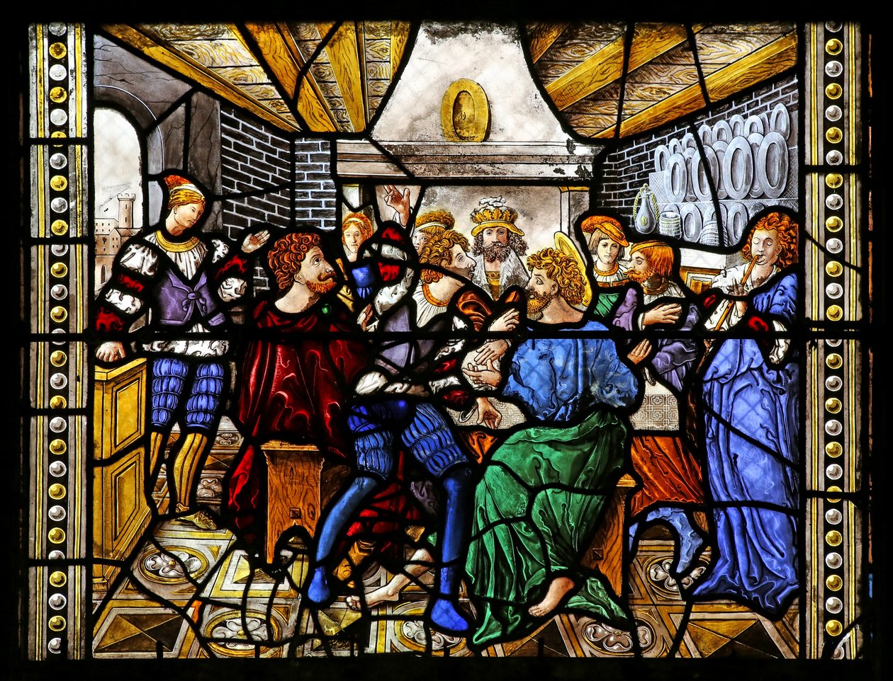 Ventana w16 que representa a Santo Tomás en India invitado a la boda de Pelagio, golpeado por un sirviente que a su vez es devorado por un león. Un perro trae el brazo del sirviente de French School