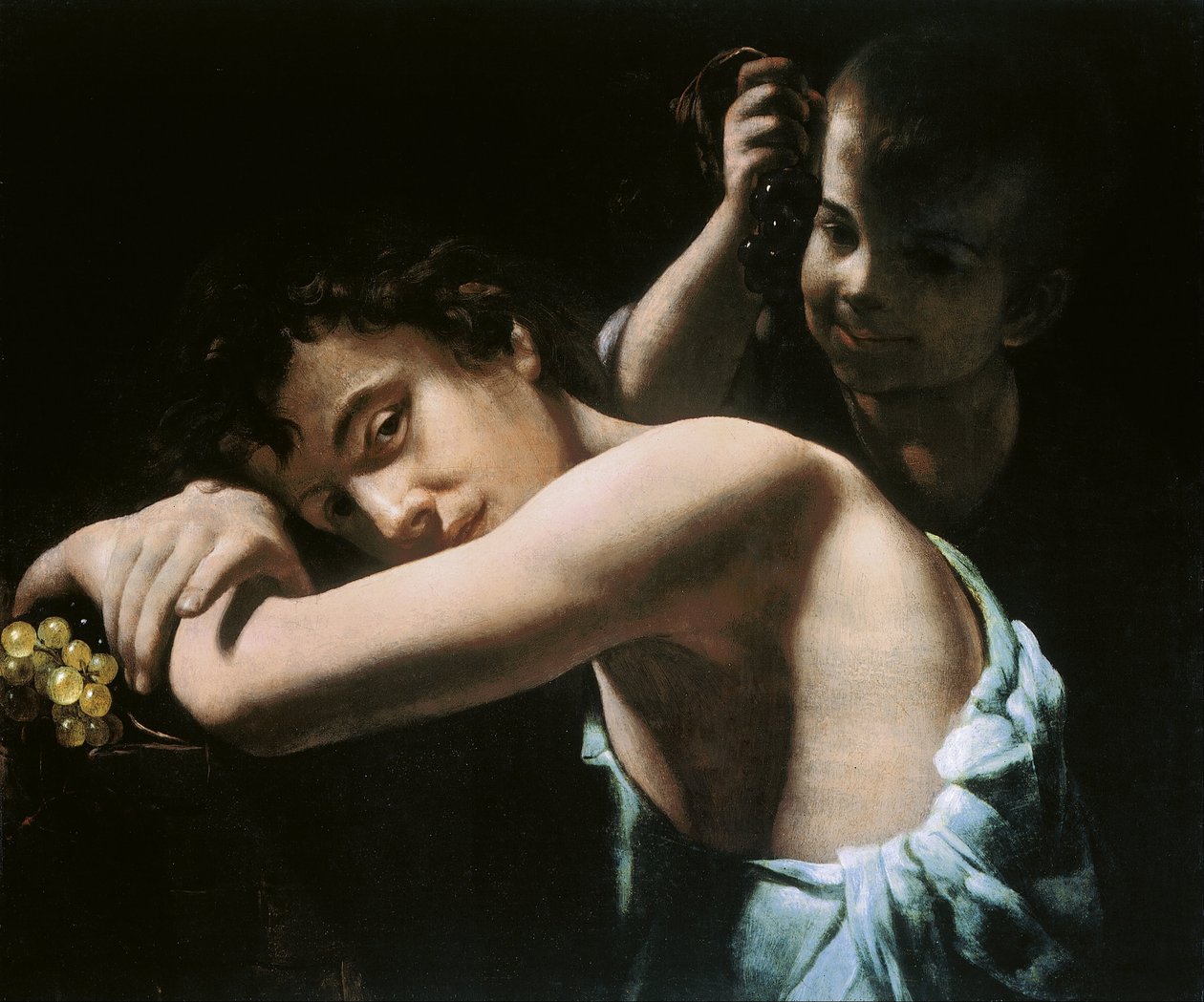 Dos jóvenes con uvas de Giovanni Battista Caracciolo