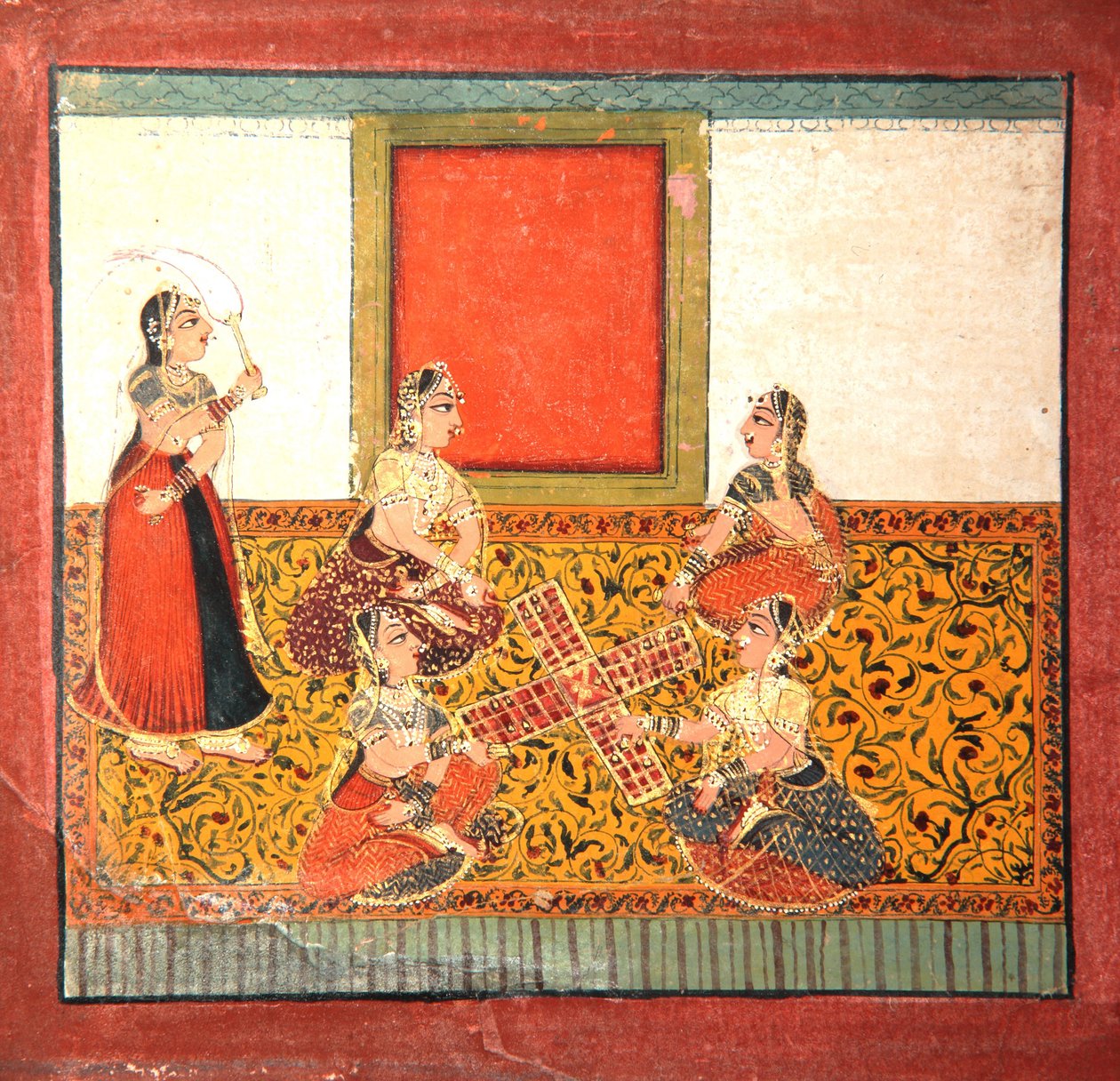 Mujeres jugando Parcheesi, sentadas en un suelo con patrón amarillo de Indian School