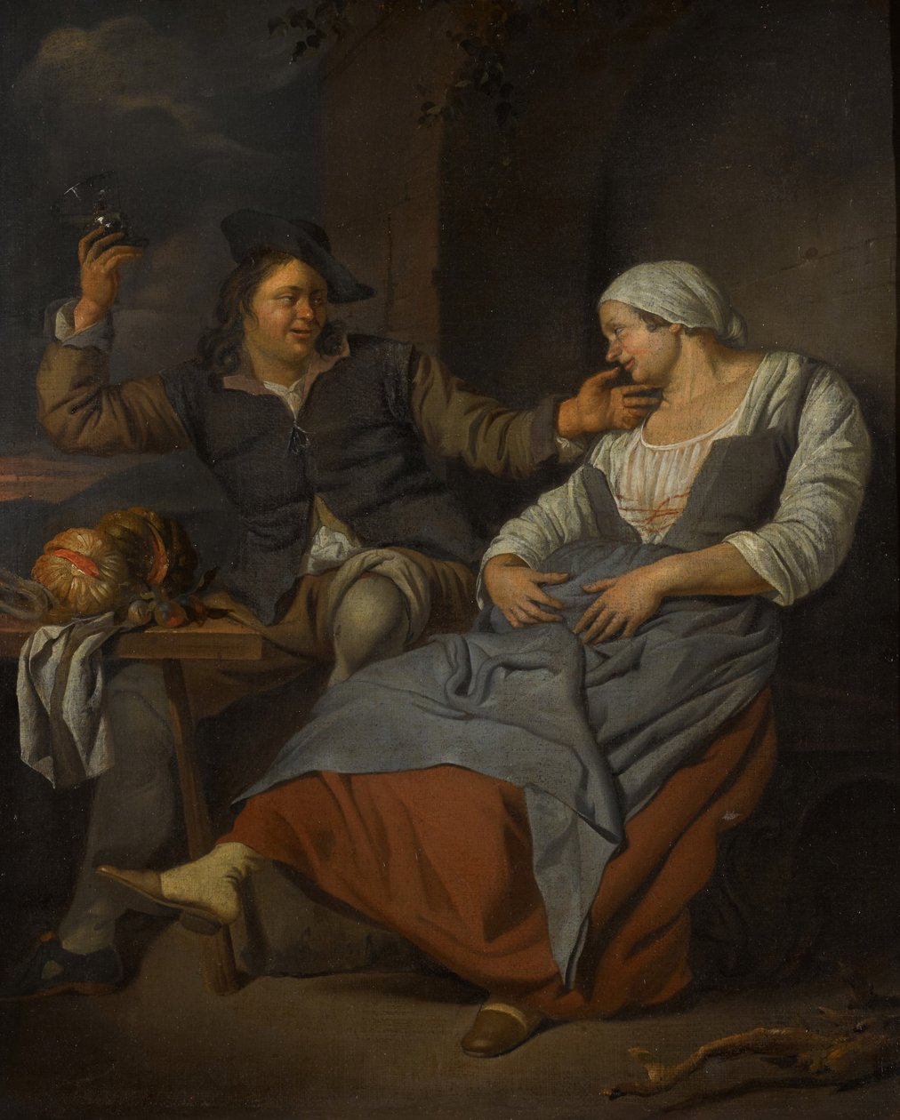 Una pareja sentada bebiendo vino de Jacob Toorenvliet