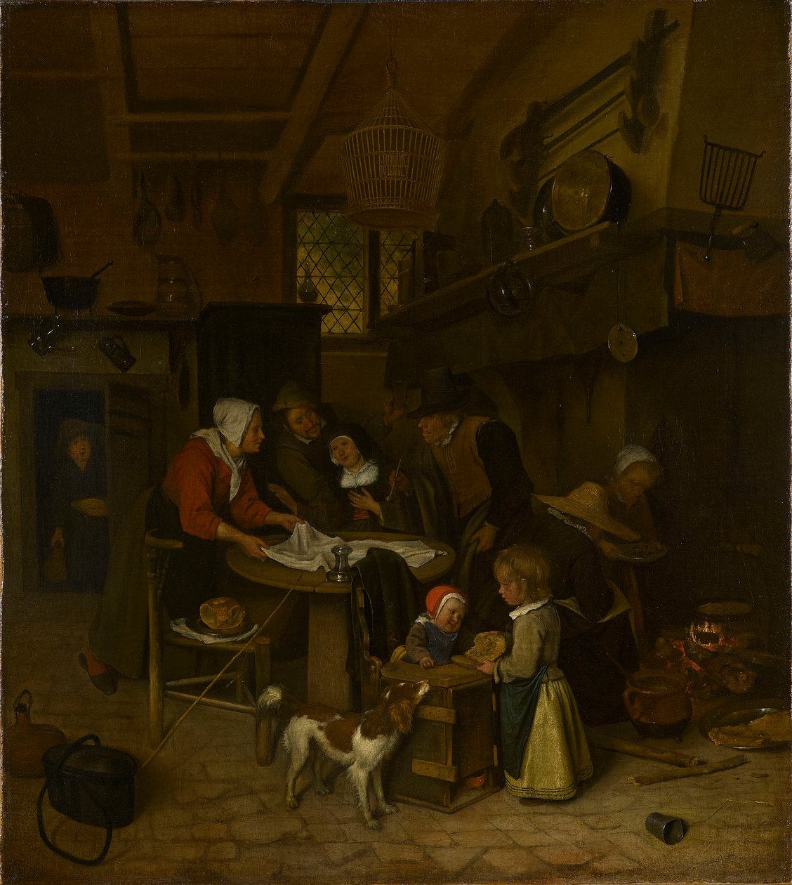 Escena en una cocina campesina con una sirvienta tendiendo la ropa de Jan Steen