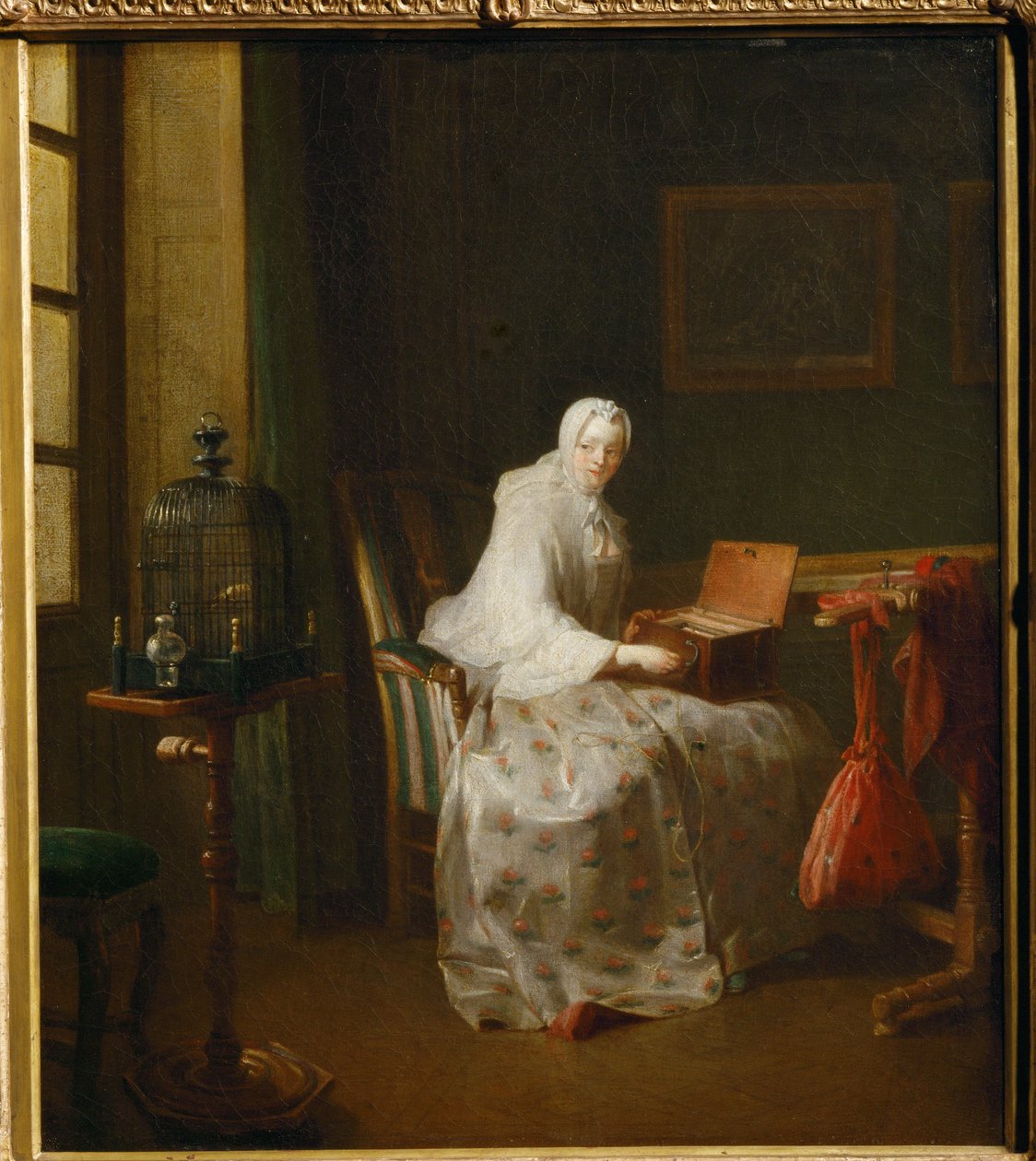 La serinette, dit aussi Dame variant ses amusements - a serinette is a small mechanical organ used to teach birds to sing ... de Jean Baptiste Simeon Chardin