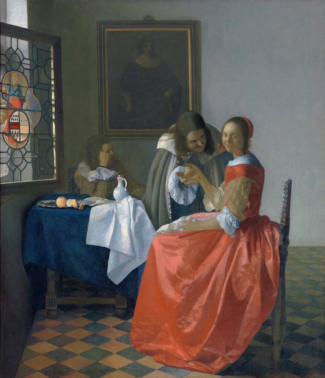 Mujer joven con una copa de vino de Johannes Vermeer