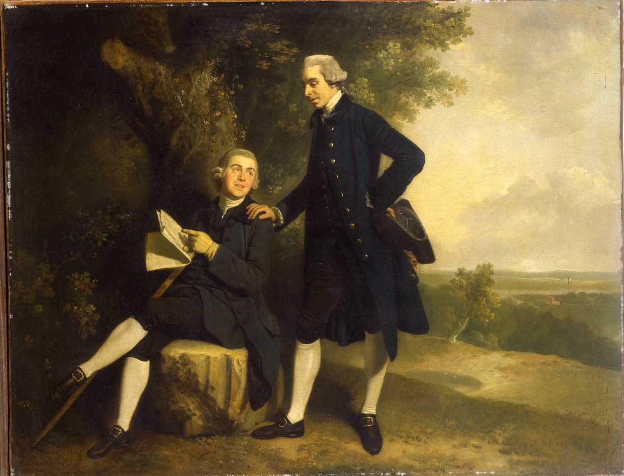 Doble Retrato de Thomas Somers Cocks y Richard Cocks de Castleditch, Ambos de Cuerpo Entero, el Primero con un Abrigo y Chaleco Azul Sosteniendo un Tricornio Negro, el Segundo Sentado con un Abrigo y Chaleco Azul Sosteniendo un Manuscrito, en un Paisaje de John Hamilton Mortimer