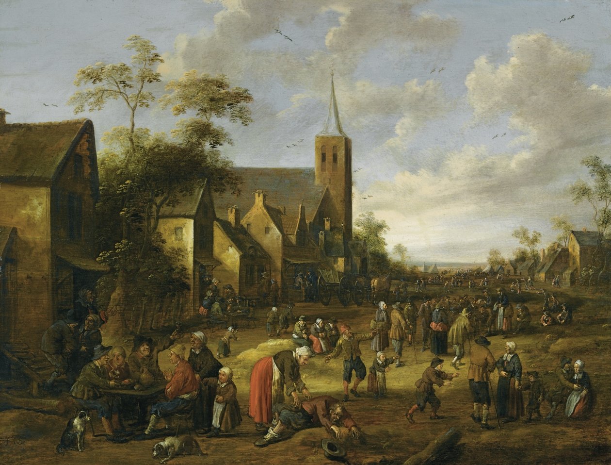 Tramo de un pueblo bullicioso con numerosas figuras, campesinos comiendo y bebiendo en una mesa en primer plano, una torre de iglesia más allá. de Joost Cornelisz Droochsloot