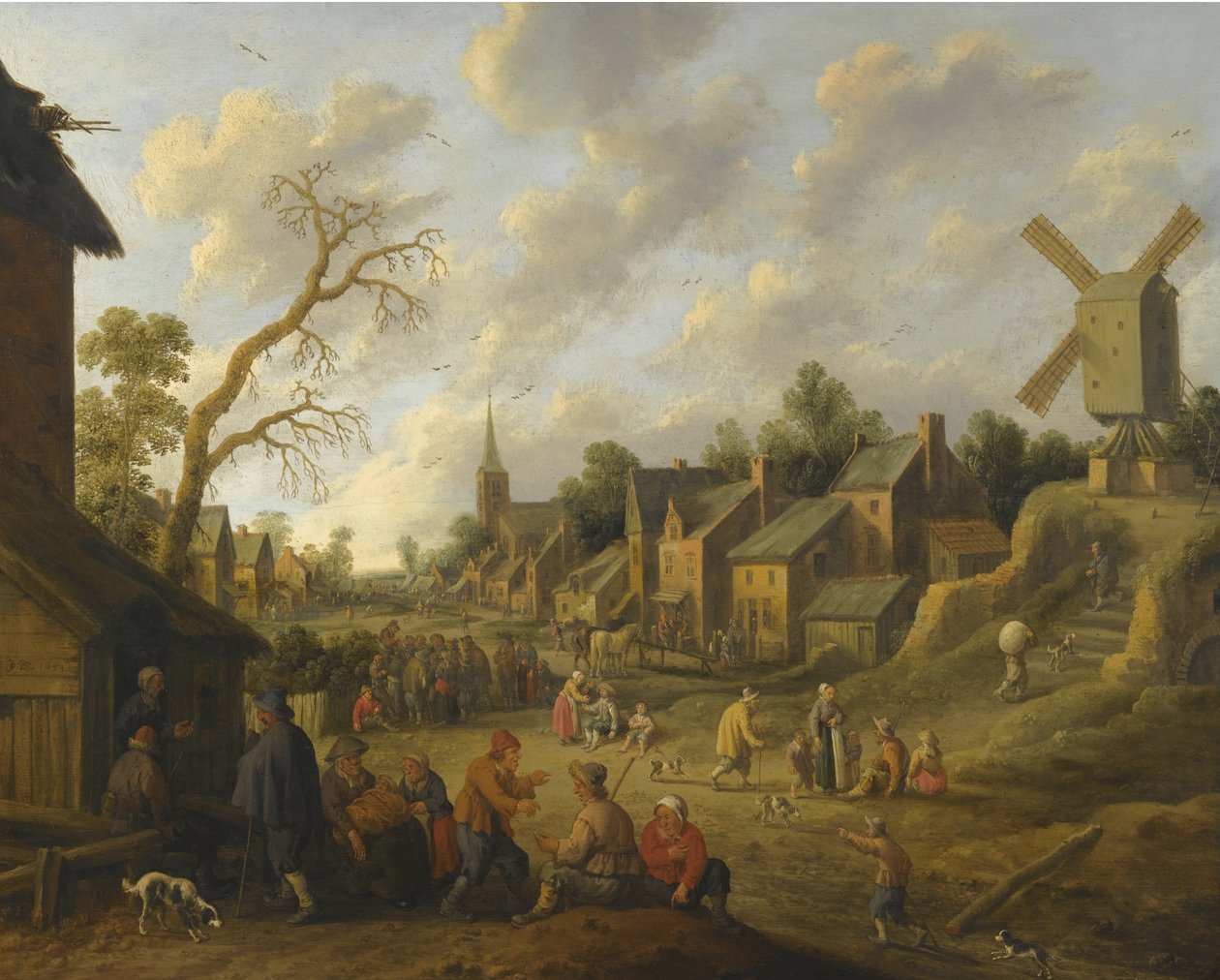 Una calle ancha a través de un pueblo lleno de numerosas figuras y dominado por un molino de viento. de Joost Cornelisz Droochsloot