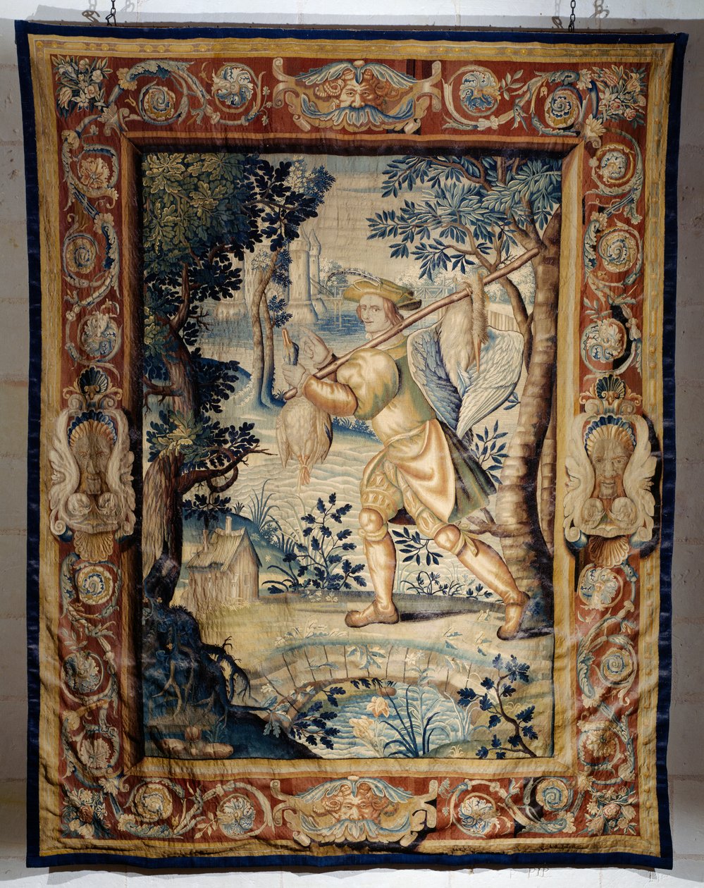 Portador de caza, tapiz de la serie Cacerías de Francisco I de Laurent Guyot