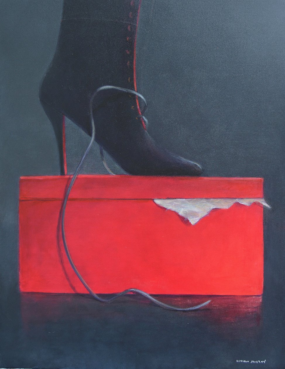 Bota en una caja roja de Lincoln Seligman