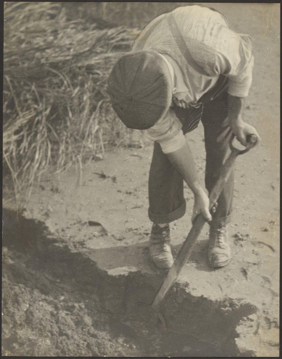 [Un hombre cavando en el barro] de Louis Fleckenstein