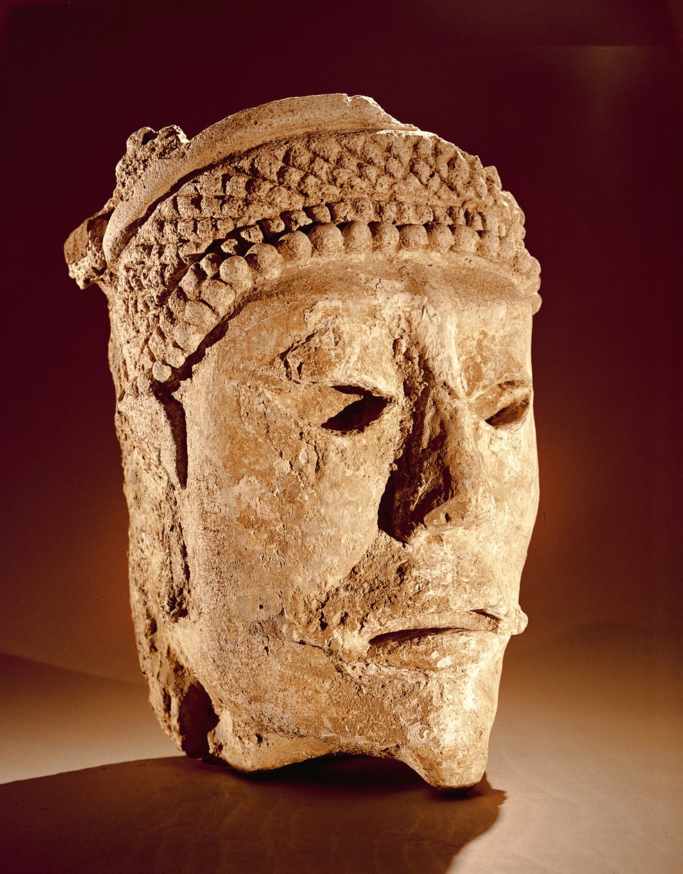 Cabeza cortada de una pared en Comalcalco, Tabasco, Maya Clásico de Mayan