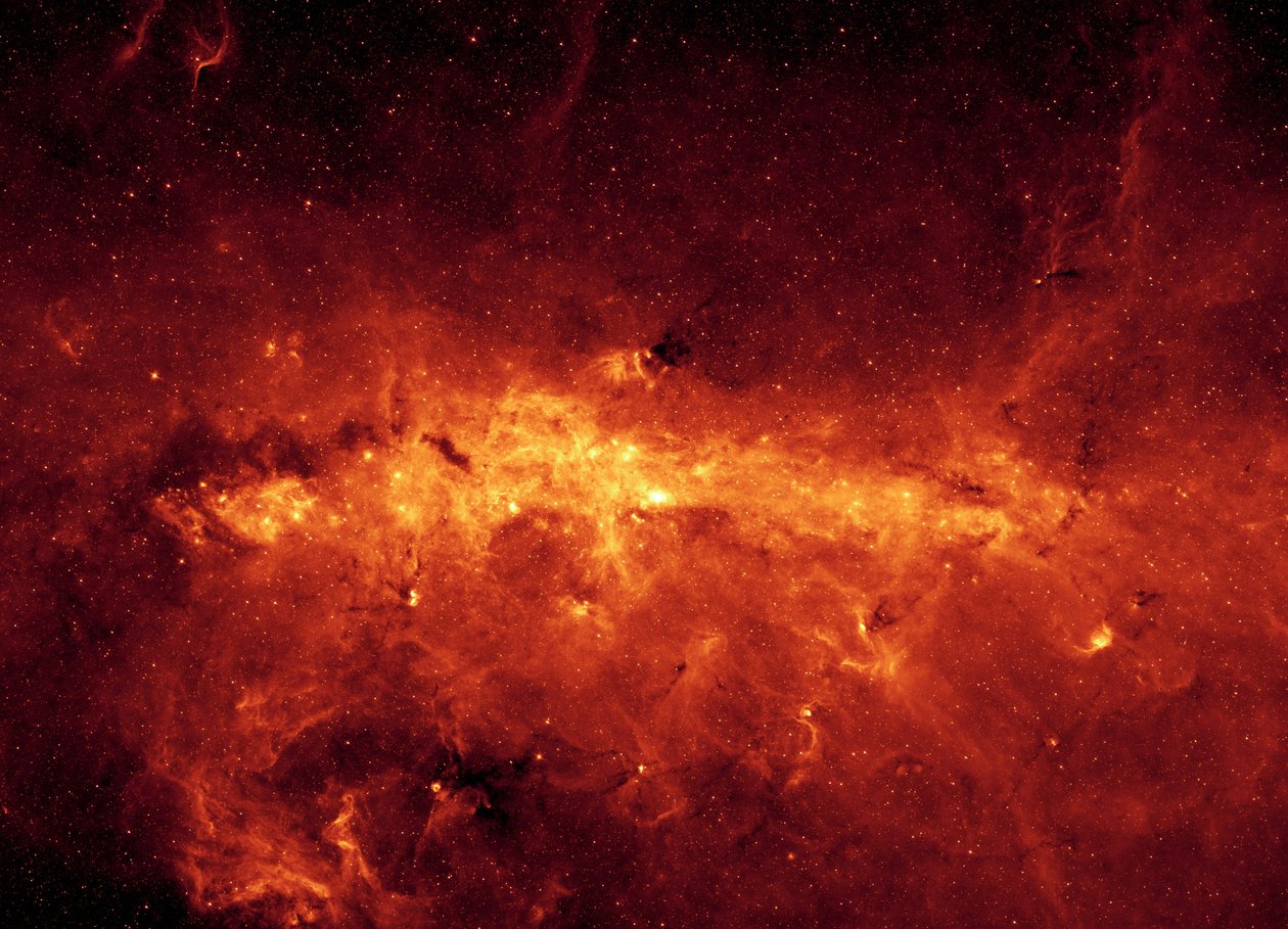 Centro de la galaxia Vía Láctea visto por el telescopio espacial Spitzer. Imagen infrarroja del centro galáctico y nubes polvorientas, iluminadas por estrellas jóvenes y masivas. Crédito NASA. Ciencia Astronomía Espacio de National Aeronautics and Space Administration National Aeronautics and Space Administration
