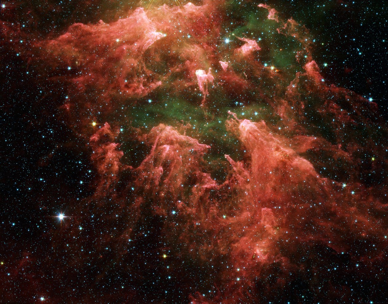 Imagen en falso color del telescopio espacial Spitzer de la región del Pilar Sur de la región de formación estelar llamada la Nebulosa Carina. Embriones estelares (amarillo o blanco) dentro de pilares en forma de dedos de polvo espeso (rosa). Gas caliente de National Aeronautics and Space Administration National Aeronautics and Space Administration