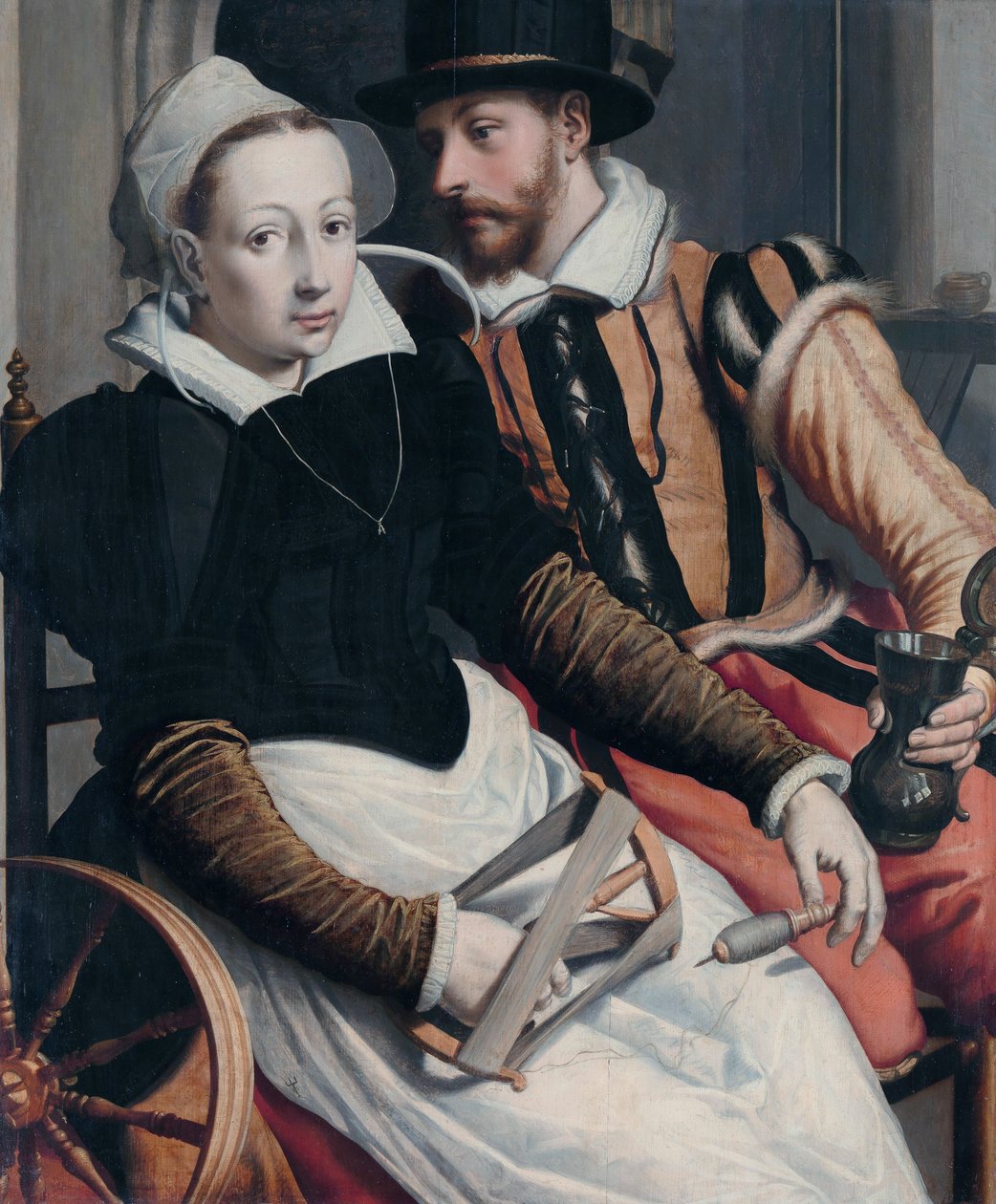 Una mujer en la rueca y un hombre con una jarra sentado en un interior de Pieter Pietersz the Elder