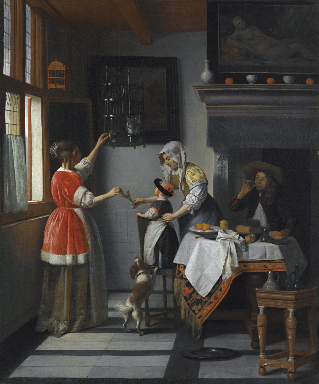 Interior con un niño alimentando a un loro de Pieter de Hooch