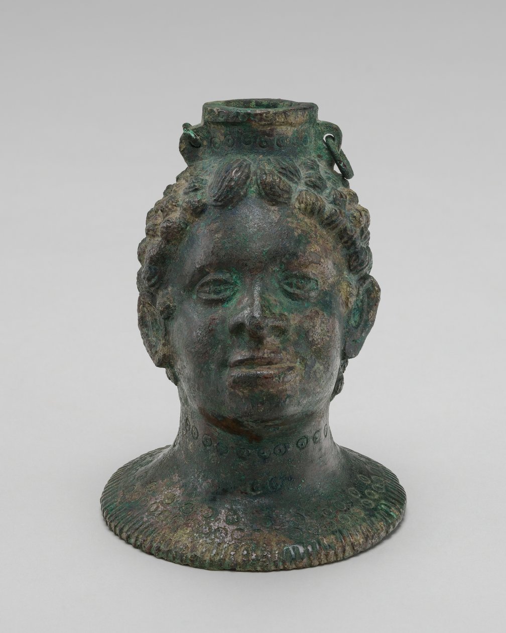 Contenedor en forma de cabeza de africano de Probably Etruscan